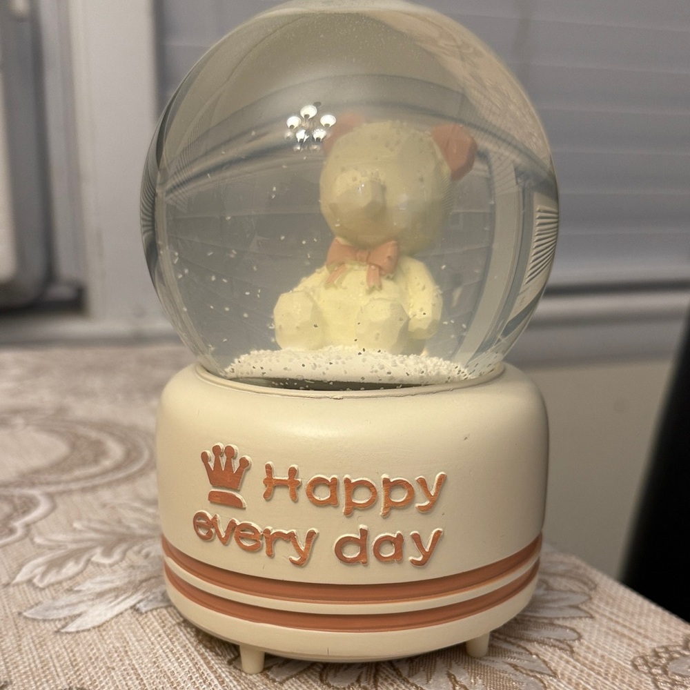 Cream and Tan Snow Globe with Bear it does light and music